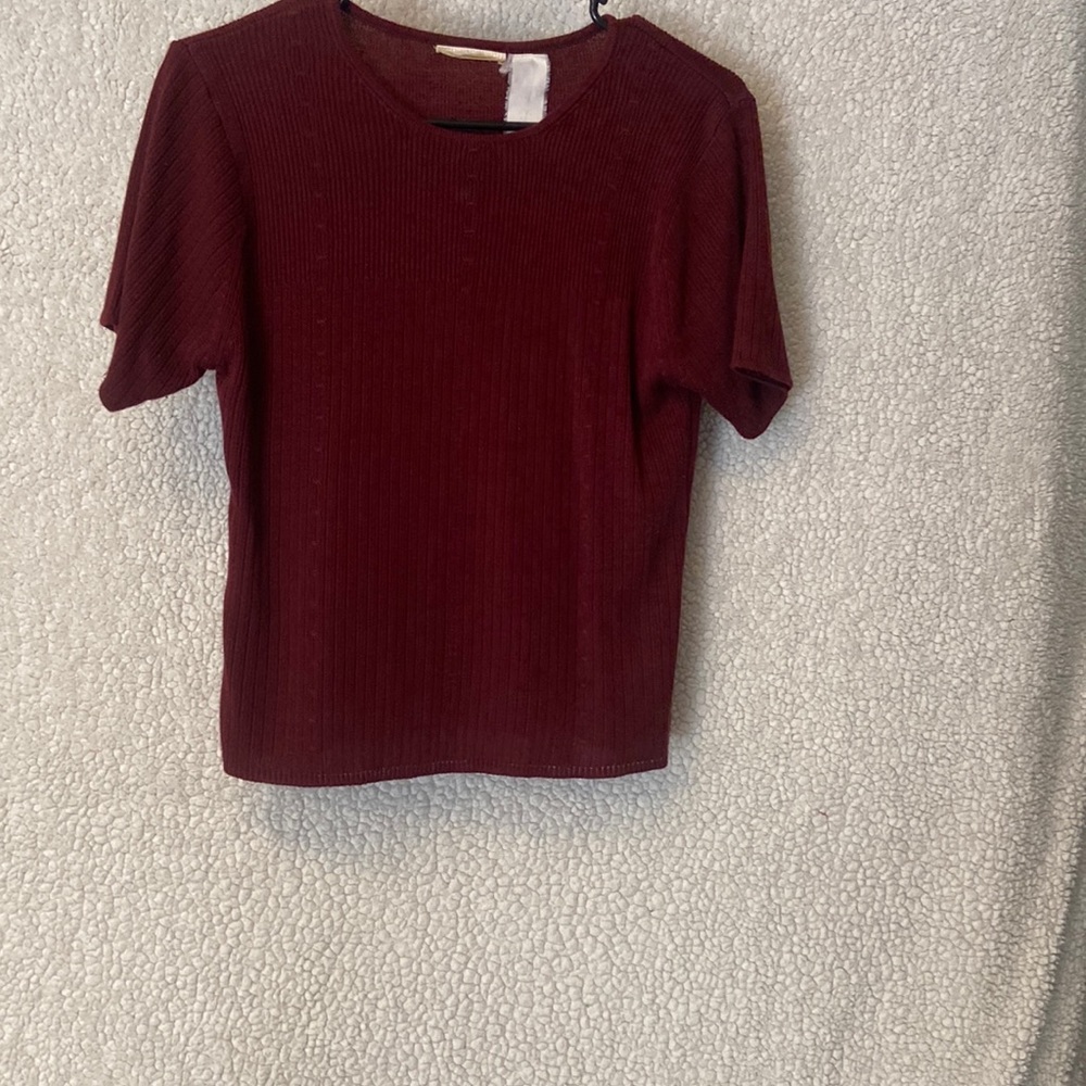Burgundy knitted top.